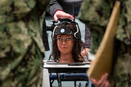 A Traumatic Brain Injury assessment device sits on display during an end-user touchpoint hosted by the Operational Medical Systems Program Management Office, Camp Lejeune, North Carolina, Jan. 14, 2026. The touchpoint at NMCCL is one in a series of planned engagements with prospective end users to help the OPMED Warfighter Readiness, Performance and Brain Health project management office refine the development of field-portable TBI detection devices designed for use in austere, remote locations across the globe. OPMED, part of the Defense Health Agency, partners with stakeholders across the Joint Force to develop, acquire, and field medical devices, treatments, and frontline care solutions for military medical providers to fill capability gaps with the speed of relevance. (Defense Health Agency photo by T. T. Parish/Released)