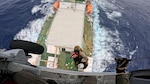 A U.S. Navy MH-60 Knighthawk helicopter crew from Helicopter Sea Combat Squadron 25 hoists a 60-year-old ill mariner from the 459-foot U.S.-flagged cable-laying ship Decisive on Jan. 13, 2026, about 110 miles off Guam for further transport to Guam for a high level of medical care. U.S. Coast Guard Joint Rescue Sub-Center Guam watchstanders received the medical evacuation request from the captain of the Decisive at approximately 10:10 a.m. local time on Jan. 12 while the ship was over 400 nautical miles offshore of Guam, outside of hoist-capable aircraft range, and worked to coordinate the medevac. (U.S. Navy photo by HSC-25)