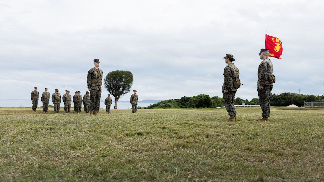 U.S. Marine Corps Maj. Codi Mullen, center right, company commander of 3rd Marine Expeditionary Brigade, dismisses the formation during an activation ceremony for 3rd MEB at Camp Courtney, Okinawa, Japan, Jan. 13, 2026. The 3rd MEB established a new headquarters company to enhance their lethality by centralizing command and synchronizing readiness efforts across warfighting functions. (U.S. Marine Corps photo by Lance Cpl. Justin Cledera)