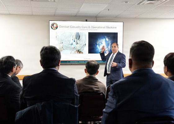 JOINT BASE SAN ANTONIO-FORT SAM HOUSTON – (Jan. 13, 2026) – Dr. Darrin Frye, Naval Medical Research Unit (NAMRU) San Antonio’s chief science director, briefs research conducted by the command’s Combat Casualty Care and Operational Medicine directorate to representatives of Japan’s National Defense Medical College (NDMC) at the Battlefield Health and Trauma Research Institute.  The visit, led by Dr. Manabu Kinoshita, NDMC’s chairman professor, Department of Immunology and Microbiology, continues a sustained partnership between NAMRU San Antonio and NDMC to enhance each other’s capabilities to counteract emerging threats, benefiting military health as well as global health security. Navy Medicine Research & Development (NMR&D) contributes directly to positive working relationships with partner nation militaries, keeping the scope of Department of War capabilities wide, and at the ready, to address emerging threats aboard. NAMRU San Antonio, part of NMR&D, conducts gap-driven combat casualty care, craniofacial, and directed energy research in support of Navy, Marine Corps and joint U.S. warfighter health readiness and lethality while engaged in routine and expeditionary operations. (U.S. Navy photo by Burrell Parmer, NAMRU San Antonio Public Affairs/Released)