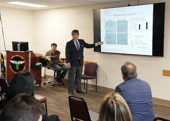 JOINT BASE SAN ANTONIO-FORT SAM HOUSTON – (Jan. 13, 2026) – Dr. Tatsuhiko Noguchi, a professor with Japan’s National Defense Medical College’s (NDMC) Laboratory of Biology, briefs leadership and research scientists assigned to Naval Medical Research Unit (NAMRU) San Antonio of research on the effects of electromagnetic on the body at the Battlefield Health and Trauma Research Institute.  A series of briefings, led by Dr. Manabu Kinoshita, NDMC’s chairman professor, Department of Immunology and Microbiology, continues a sustained partnership between NAMRU San Antonio and NDMC to enhance each other’s capabilities to counteract emerging threats, benefiting military health as well as global health security. Navy Medicine Research & Development (NMR&D) contributes directly to positive working relationships with partner nation militaries, keeping the scope of Department of War capabilities wide, and at the ready, to address emerging threats aboard. NAMRU San Antonio, part of NMR&D, conducts gap-driven combat casualty care, craniofacial, and directed energy research in support of Navy, Marine Corps and joint U.S. warfighter health readiness and lethality while engaged in routine and expeditionary operations. (U.S. Navy photo by Burrell Parmer, NAMRU San Antonio Public Affairs/Released)