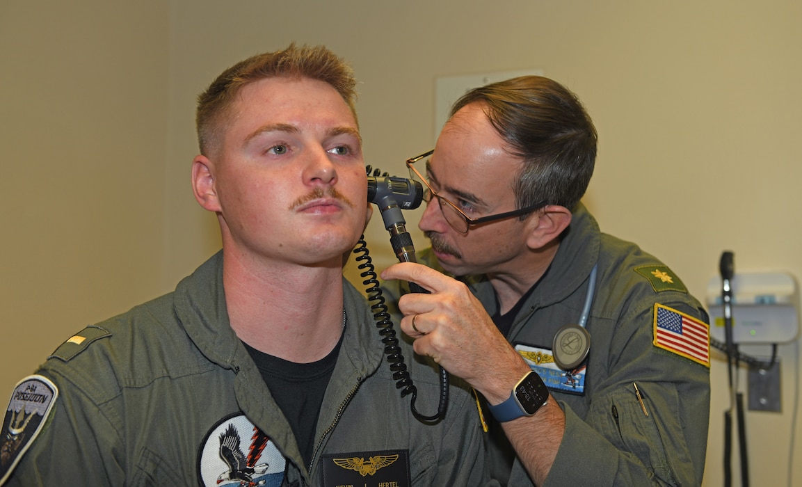 260108-N-ME175-1002 JACKSONVILLE, FL (Jan. 8, 2026) Flight Surgeon Lt. Cmdr. Joshua Fish of Patrol Squadron (VP) 30, right, performs a flight physical on Ens. Kevin Hertal of VP-30 Jan. 8. Flight physicals are regularly performed on an annual basis. (U.S. Navy photo by Julie M. Lucas)