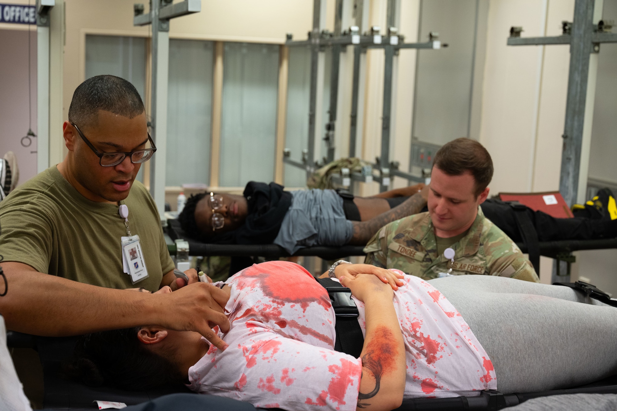 Airmen assigned to the 39th Medical Group, provide medical care to a simulated victim.