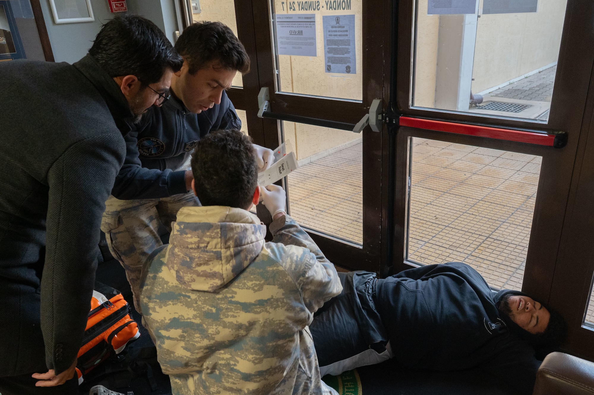 Turkish Air Force members prepare simulated victim for transport.