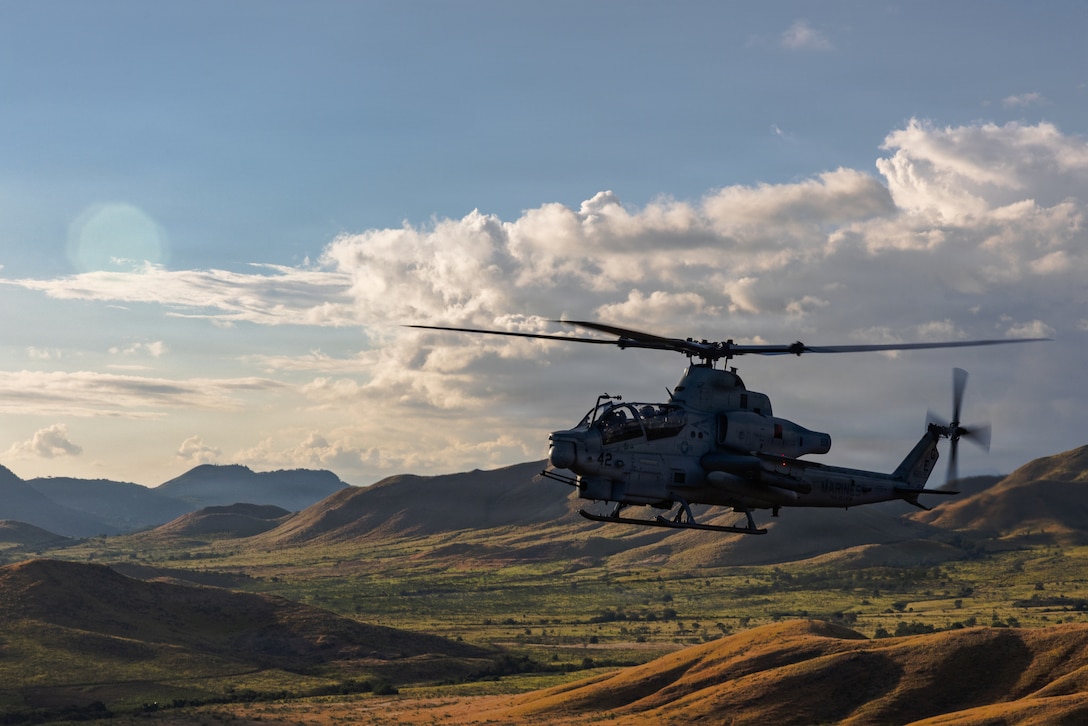 A U.S. Marine AH-1Z Viper with Marine Medium Tiltrotor Squadron (VMM) 263 (Reinforced), 22nd Marine Expeditionary Unit (Special Operations Capable), conducts flight operations at Camp Santiago, Puerto Rico, Jan. 3, 2026. U.S. military forces are deployed to the Caribbean in support of the U.S. Southern Command mission, Department of War-directed operations, and the president’s priorities to disrupt illicit drug trafficking and protect the homeland. (U.S. Marine Corps photo)