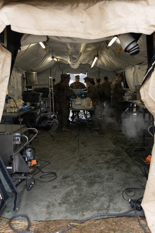 U.S. Marines cook various meals during a food service competition at Marine Wing Support Squadron (MWSS) 472, Wyoming, Pennsylvania, Jan. 11, 2026. Marines participated in an inspection for the Maj. Gen. William Pendleton Thompson Hill Awards to demonstrate their quality of food preparation, sanitation, and customer service. (U.S. Marine Corps photo by Lance Cpl. Priscilla Flores)
