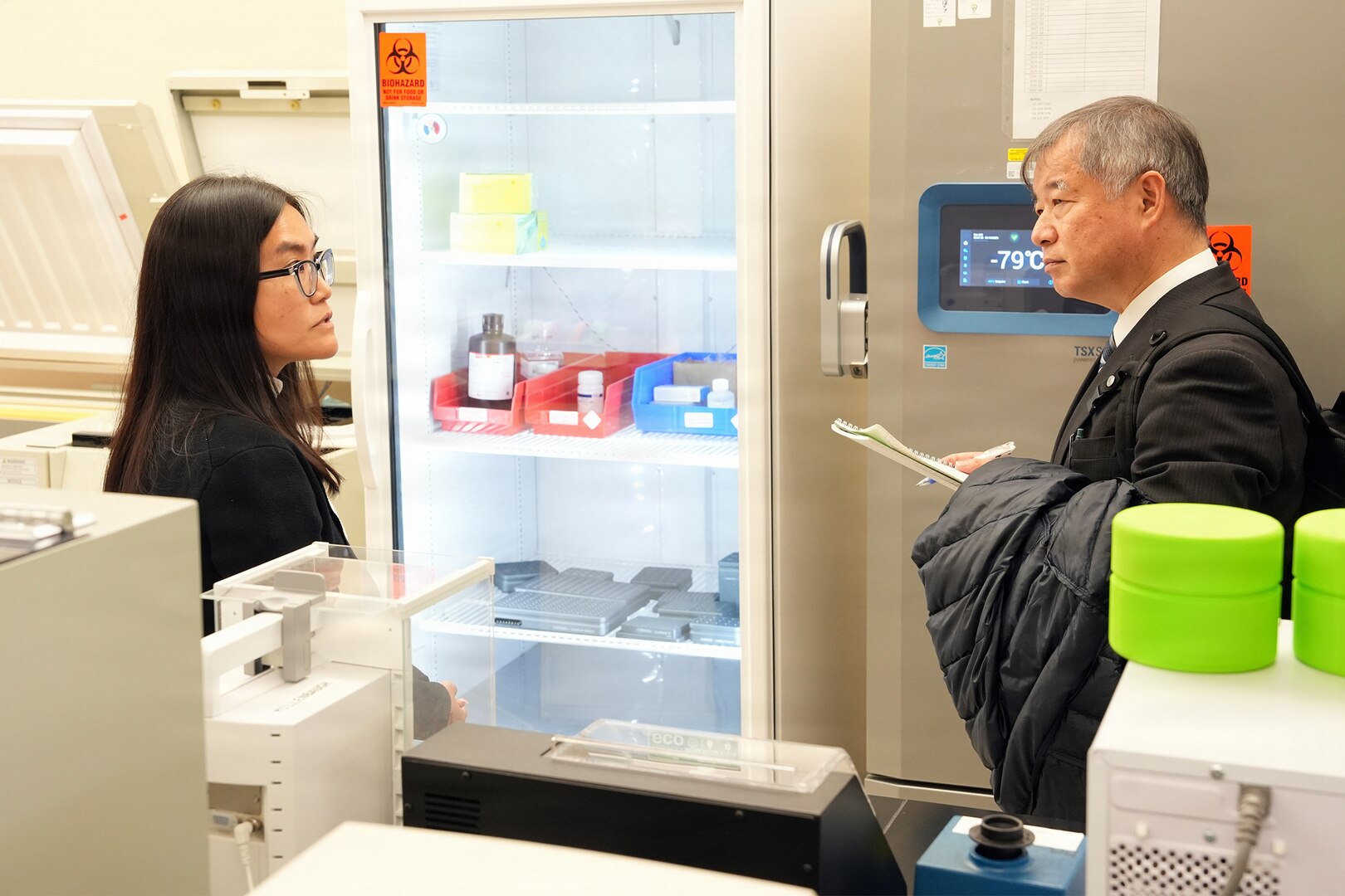 Dr. Dao Ho, a research immunologist assigned to Naval Medical Research Unit (NAMRU) San Antonio’s Combat Casualty Care and Operational Medicine directorate, speaks with Dr. Manabu Kinoshita, Japan’s National Defense Medical College’s (NDMC) chairman professor, Department of Immunology and Microbiology, on the types of research conducted by NAMRU San Antonio at the Battlefield Health and Trauma Research Institute. Kinoshita and fellow colleagues’ visit, continue a sustained partnership between NAMRU San Antonio and NDMC to enhance each other’s capabilities to counteract emerging threats, benefiting military health as well as global health security. Navy Medicine Research & Development (NMR&D) contributes directly to positive working relationships with partner nation militaries, keeping the scope of Department of War capabilities wide, and at the ready, to address emerging threats aboard. NAMRU San Antonio, part of NMR&D, conducts gap-driven combat casualty care, craniofacial, and directed energy research in support of Navy, Marine Corps and joint U.S. warfighter health readiness and lethality while engaged in routine and expeditionary operations. (U.S. Navy photo by Burrell Parmer, NAMRU San Antonio Public Affairs/Released)
