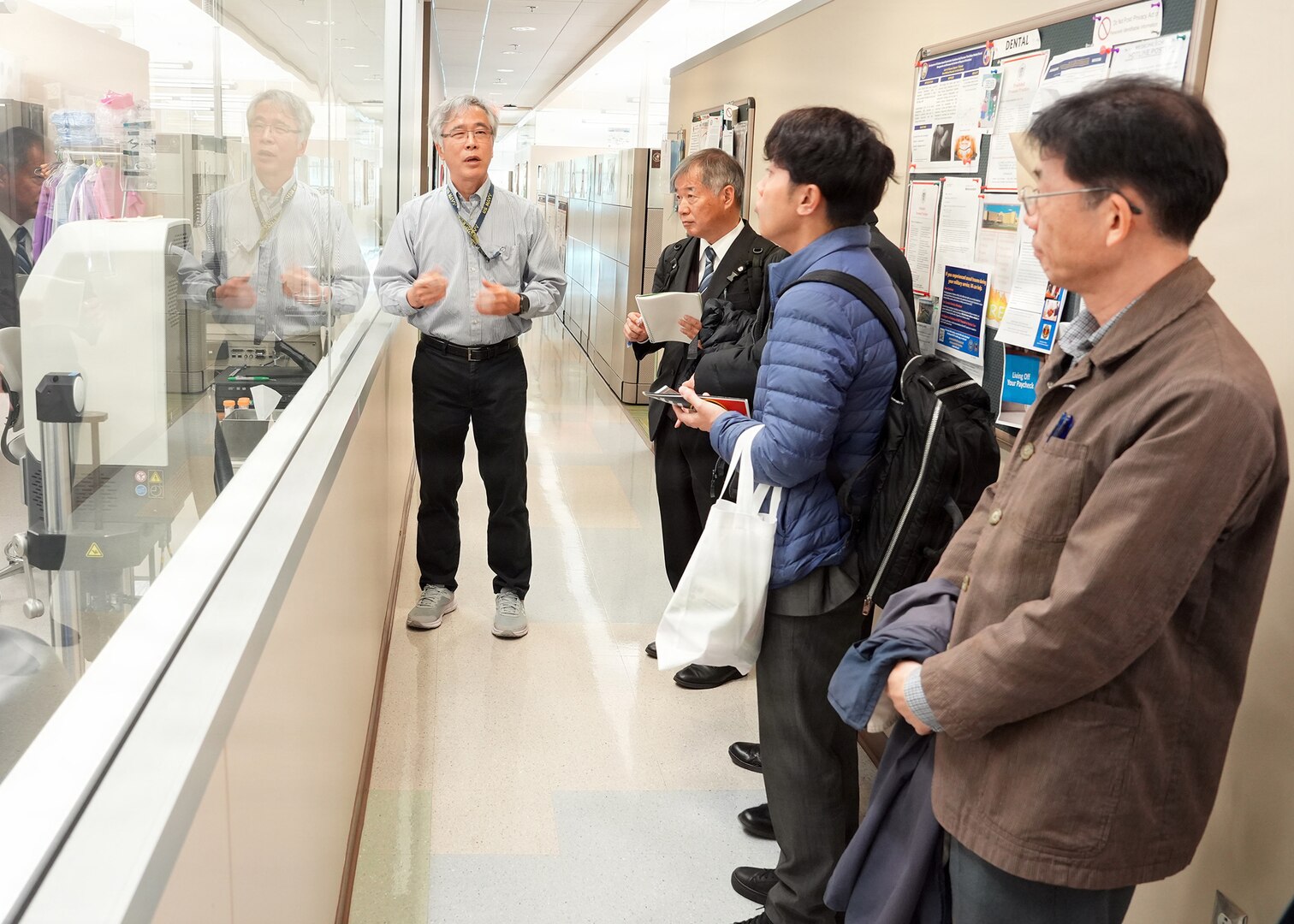 JOINT BASE SAN ANTONIO-FORT SAM HOUSTON – (Jan. 13, 2026) – Dr. Yoon Hwang, a research scientist assigned to Naval Medical Research Unit (NAMRU) San Antonio’s Environmental Surveillance Department, gives a tour of research facilities at the Battlefield Health and Trauma Research Institute to representatives of Japan’s National Defense Medical College’s (NDMC).  The visit, led by Dr. Manabu Kinoshita, NDMC’s chairman professor, Department of Immunology and Microbiology, continues a sustained partnership between NAMRU San Antonio and NDMC to enhance each other’s capabilities to counteract emerging threats, benefiting military health as well as global health security. Navy Medicine Research & Development (NMR&D) contributes directly to positive working relationships with partner nation militaries, keeping the scope of Department of War capabilities wide, and at the ready, to address emerging threats aboard. NAMRU San Antonio, part of NMR&D, conducts gap-driven combat casualty care, craniofacial, and directed energy research in support of Navy, Marine Corps and joint U.S. warfighter health readiness and lethality while engaged in routine and expeditionary operations. (U.S. Navy photo by Burrell Parmer, NAMRU San Antonio Public Affairs/Released)