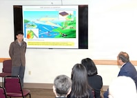 JOINT BASE SAN ANTONIO-FORT SAM HOUSTON – (Jan. 13, 2026) – Dr. Kohsuke Hagisawa, an associate professor with Japan’s National Defense Medical College’s (NDMC) Department of Physiology, briefs leadership and research scientists assigned to Naval Medical Research Unit (NAMRU) San Antonio of research on the effects of electromagnetic on the body at the Battlefield Health and Trauma Research Institute.  A series of briefings, led by Dr. Manabu Kinoshita, NDMC’s chairman professor, Department of Immunology and Microbiology, continues a sustained partnership between NAMRU San Antonio and NDMC to enhance each other’s capabilities to counteract emerging threats, benefiting military health as well as global health security. Navy Medicine Research & Development (NMR&D) contributes directly to positive working relationships with partner nation militaries, keeping the scope of Department of War capabilities wide, and at the ready, to address emerging threats aboard. NAMRU San Antonio, part of NMR&D, conducts gap-driven combat casualty care, craniofacial, and directed energy research in support of Navy, Marine Corps and joint U.S. warfighter health readiness and lethality while engaged in routine and expeditionary operations. (U.S. Navy photo by Burrell Parmer, NAMRU San Antonio Public Affairs/Released)