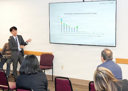 JOINT BASE SAN ANTONIO-FORT SAM HOUSTON – (Jan. 13, 2026) – Dr. Makoto Aoki, an associate professor with Japan’s National Defense Medical College’s (NDMC) Department of Traumatology and Critical Care Medicine, briefs leadership and research scientists assigned to Naval Medical Research Unit (NAMRU) San Antonio of research on the synergic of H12-liposome in addition to whole blood at the Battlefield Health and Trauma Research Institute.  A series of briefings, led by Dr. Manabu Kinoshita, NDMC’s chairman professor, Department of Immunology and Microbiology, continues a sustained partnership between NAMRU San Antonio and NDMC to enhance each other’s capabilities to counteract emerging threats, benefiting military health as well as global health security. Navy Medicine Research & Development (NMR&D) contributes directly to positive working relationships with partner nation militaries, keeping the scope of Department of War capabilities wide, and at the ready, to address emerging threats aboard. NAMRU San Antonio, part of NMR&D, conducts gap-driven combat casualty care, craniofacial, and directed energy research in support of Navy, Marine Corps and joint U.S. warfighter health readiness and lethality while engaged in routine and expeditionary operations. (U.S. Navy photo by Burrell Parmer, NAMRU San Antonio Public Affairs/Released)