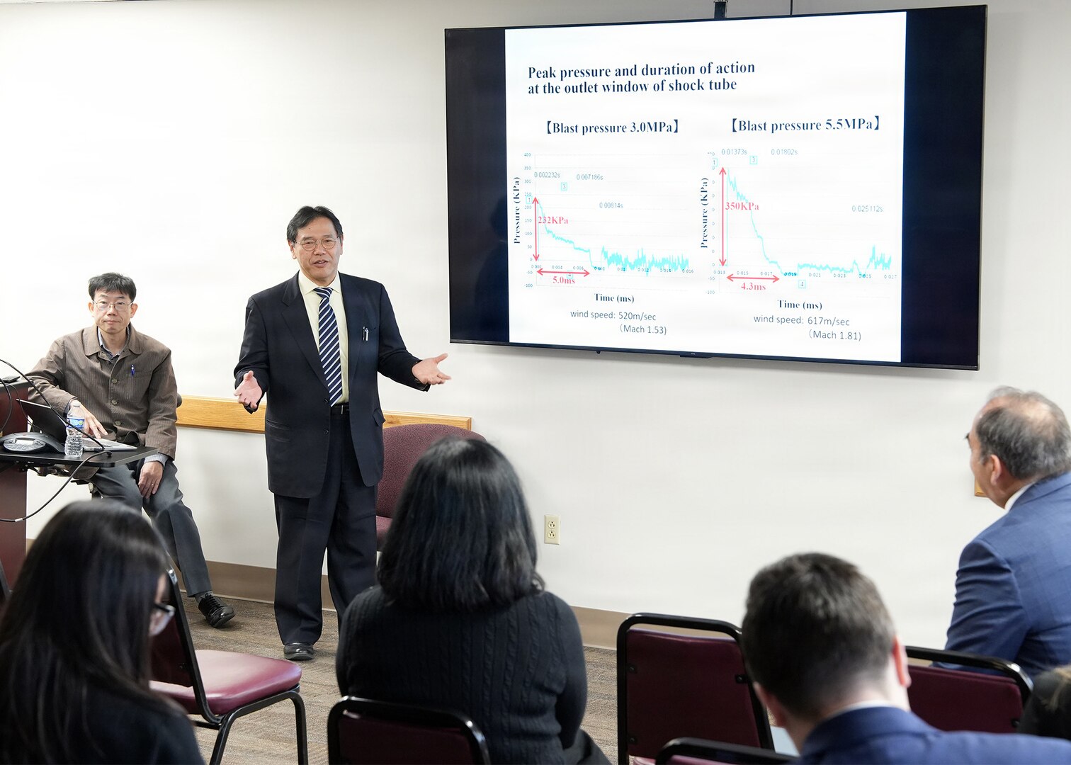 JOINT BASE SAN ANTONIO-FORT SAM HOUSTON – (Jan. 13, 2026) – Dr. Nobuaki Kiriu, an associate professor with Japan’s National Defense Medical College’s (NDMC) Center for Trauma, Burn and Tactical Medicine, briefs leadership and research scientists assigned to Naval Medical Research Unit (NAMRU) San Antonio of research on blast injury utilizing an air-driven shockwave generator at the Battlefield Health and Trauma Research Institute.  A series of briefings, led by Dr. Manabu Kinoshita, NDMC’s chairman professor, Department of Immunology and Microbiology, continues a sustained partnership between NAMRU San Antonio and NDMC to enhance each other’s capabilities to counteract emerging threats, benefiting military health as well as global health security. Navy Medicine Research & Development (NMR&D) contributes directly to positive working relationships with partner nation militaries, keeping the scope of Department of War capabilities wide, and at the ready, to address emerging threats aboard. NAMRU San Antonio, part of NMR&D, conducts gap-driven combat casualty care, craniofacial, and directed energy research in support of Navy, Marine Corps and joint U.S. warfighter health readiness and lethality while engaged in routine and expeditionary operations. (U.S. Navy photo by Burrell Parmer, NAMRU San Antonio Public Affairs/Released)