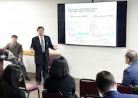 JOINT BASE SAN ANTONIO-FORT SAM HOUSTON – (Jan. 13, 2026) – Dr. Nobuaki Kiriu, an associate professor with Japan’s National Defense Medical College’s (NDMC) Center for Trauma, Burn and Tactical Medicine, briefs leadership and research scientists assigned to Naval Medical Research Unit (NAMRU) San Antonio of research on blast injury utilizing an air-driven shockwave generator at the Battlefield Health and Trauma Research Institute.  A series of briefings, led by Dr. Manabu Kinoshita, NDMC’s chairman professor, Department of Immunology and Microbiology, continues a sustained partnership between NAMRU San Antonio and NDMC to enhance each other’s capabilities to counteract emerging threats, benefiting military health as well as global health security. Navy Medicine Research & Development (NMR&D) contributes directly to positive working relationships with partner nation militaries, keeping the scope of Department of War capabilities wide, and at the ready, to address emerging threats aboard. NAMRU San Antonio, part of NMR&D, conducts gap-driven combat casualty care, craniofacial, and directed energy research in support of Navy, Marine Corps and joint U.S. warfighter health readiness and lethality while engaged in routine and expeditionary operations. (U.S. Navy photo by Burrell Parmer, NAMRU San Antonio Public Affairs/Released)