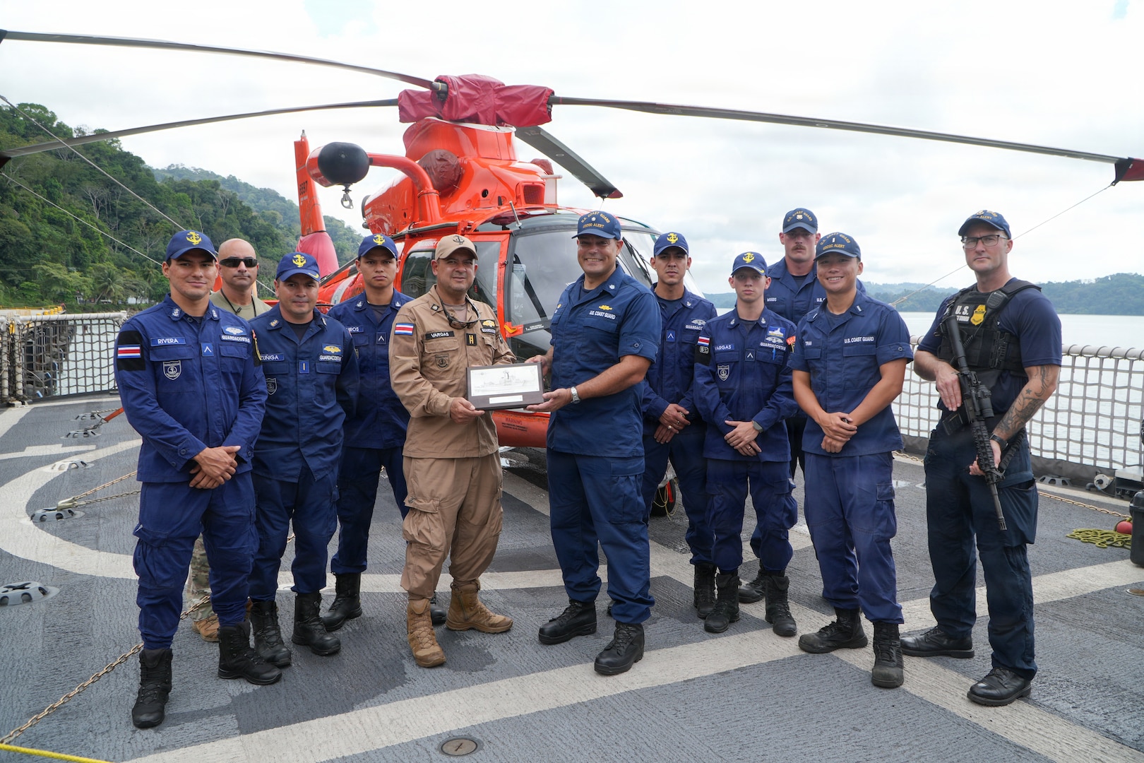 Costa Rican Coast Guard and U.S. Coast Guard Cutter Alert (WMEC 630) crew members pose for a photo aboard the cutter in Golfito, Costa Rica, Jan. 2, 2026. Alert's crew hosted the Costa Rican personnel for a tour of the cutter and embarked MH-65 Dolphin helicopter as well as discussions of ways to strengthen the presence of international counter-drug efforts in the region. (U.S. Coast Guard photo by Ensign Ethan Lasher)