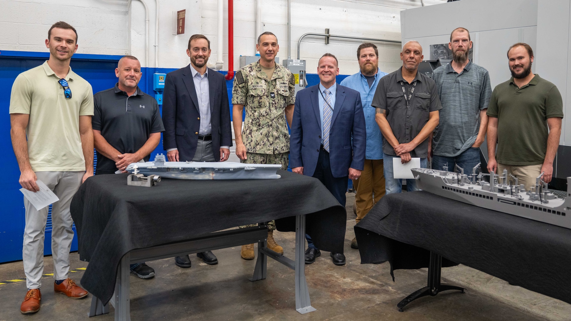 Mr. Christopher Miller and Mr. Thomas Perotti visited Carderock on Aug. 28, 2025, to recognize of team of Carderock employees who fabricated four 1/250th scale surface ship models in eight calendar days at the request of NAVSEA. From left to right: Matthew Gutmann (Code 822 Engineer), Josh Crum (Code 621 Branch Head), Mr. Miller (Executive Director NAVSEA), Captain Matassa (Commanding Officer NSWC Carderock), Mr. Perotti (Executive Director Warfare Centers), Adam Smith, (Code 621 Additive and Subtractive Technician), Alexis Colon (Code 621 Additive and Subtractive Technician), Tim Lewis (Code 623 Planner and Estimator) and John Grant Dixon (Code 822 Engineer).