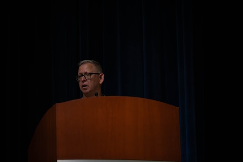 a person speaks to an audience