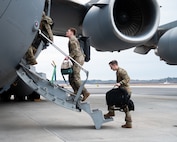 U.S. Air Force Airman board a C-17 Globemaster III.