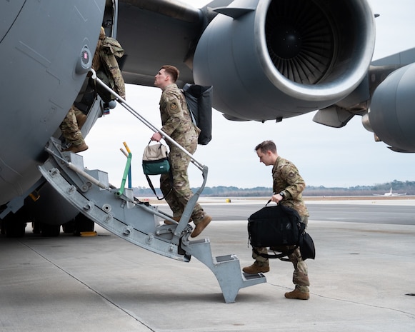 U.S. Air Force Airman board a C-17 Globemaster III.