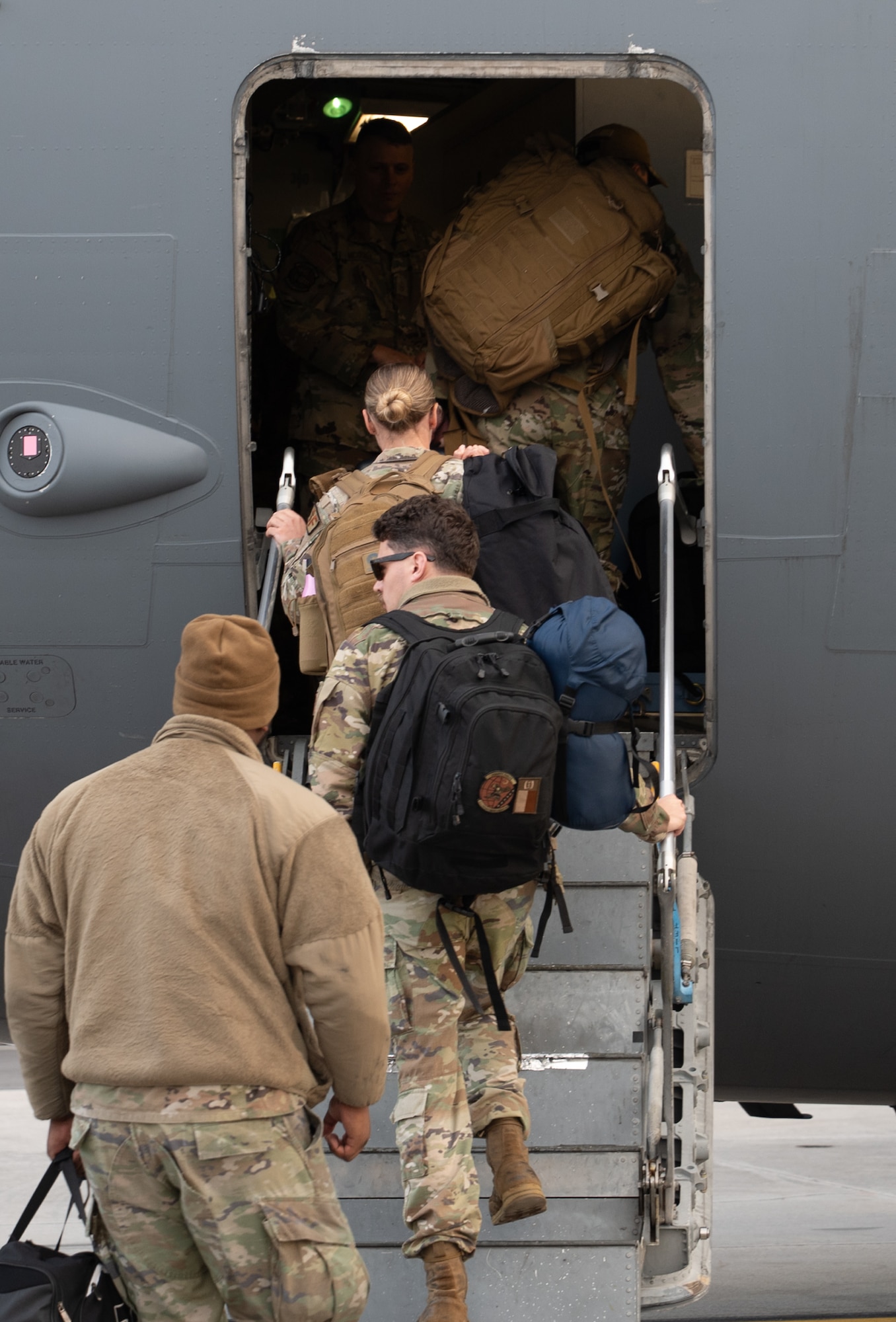 U.S. Air Force Airmen board a C17 Globemaster III.