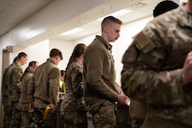 U.S. Air Airforce Airmen are processed through the personnel deployment function line.