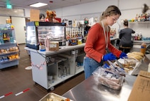 Barista Ava Walsh prepares fresh sandwiches for Anchors Aweigh customers at Puget Sound Naval Shipyard & Intermediate Maintenance Facility in Bremerton Washington, Nov. 13, 2025. The Kitsap County-based company opened two locations at PSNS & IMF late last year. (U.S. Navy photos by Wendy Hallmark)