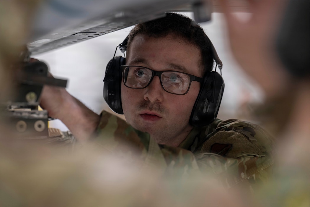 U.S. Air Force Staff Sgt. Cody Fowler, 18th Fighter Generation Squadron weapons load crew chief, secures a dummy CATM-120B missile onto an F-16 Fighting Falcon during a 4th Quarter Load Competition at Eielson Air Force Base, Alaska, Jan. 9, 2026.