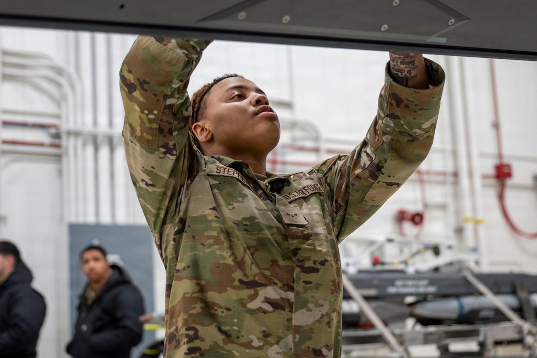 U.S. Air Force Airman 1st Class Jasmaine Stephens, 356th Fighter Generation Squadron weapons load crew member, prepares the missile rail of an F-35A Lightning II during the 4th Quarter Load Competition at Eielson Air Force Base, Alaska, Jan. 9, 2026.