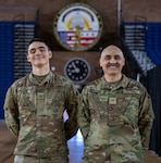 U.S Army Maj. Roy Baker, right, 45th Field Artillery, and Pfc. Radomir Baker, 2-245th Headquarters and Headquarters Company, pose for a photo in the District of Columbia Armory in Washington, D.C. Jan. 13, 2026. About 2,500 National Guard members are supporting the D.C. Safe and Beautiful mission providing critical support to the D.C. Metropolitan Police Department in ensuring the safety of all who live, work and visit the District. (U.S. Army National Guard Photo by Spc. Paris Hayes)