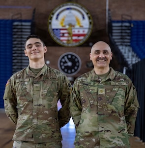 U.S Army Maj. Roy Baker, right, 45th Field Artillery, and Pfc. Radomir Baker, 2-245th Headquarters and Headquarters Company, pose for a photo in the District of Columbia Armory in Washington, D.C. Jan. 13, 2026. About 2,500 National Guard members are supporting the D.C. Safe and Beautiful mission providing critical support to the D.C. Metropolitan Police Department in ensuring the safety of all who live, work and visit the District. (U.S. Army National Guard Photo by Spc. Paris Hayes)