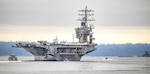 USS Nimitz (CVN 68) makes its way past Manchester State Park as it exits Rich Passage Feb. 7, 2022, after departing Puget Sound Naval Shipyard & Intermediate Maintenance Facility in Bremerton, Washington. Nimitz is currently underway conducting routine operations. (PSNS & IMF photo by Scott Hansen)