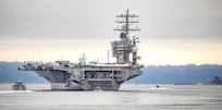 USS Nimitz (CVN 68) makes its way past Manchester State Park as it exits Rich Passage Feb. 7, 2022, after departing Puget Sound Naval Shipyard & Intermediate Maintenance Facility in Bremerton, Washington. Nimitz is currently underway conducting routine operations. (PSNS & IMF photo by Scott Hansen)
