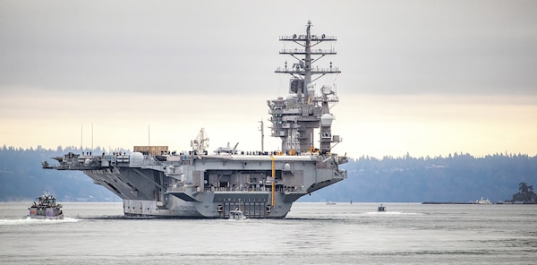USS Nimitz (CVN 68) makes its way past Manchester State Park as it exits Rich Passage Feb. 7, 2022, after departing Puget Sound Naval Shipyard & Intermediate Maintenance Facility in Bremerton, Washington. Nimitz is currently underway conducting routine operations. (PSNS & IMF photo by Scott Hansen)