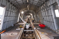 Aircraft Launch and Recovery team members from Shop 38, Marine Machinist, work to align one of three catapults aboard USS Nimitz (CVN 68) Jan. 7, 2024, during a six-month planned incremental availability at Puget Sound Naval Shipyard & Intermediate Maintenance Facility in Bremerton, Washington. (U.S. Navy photo by Wendy Hallmark)
