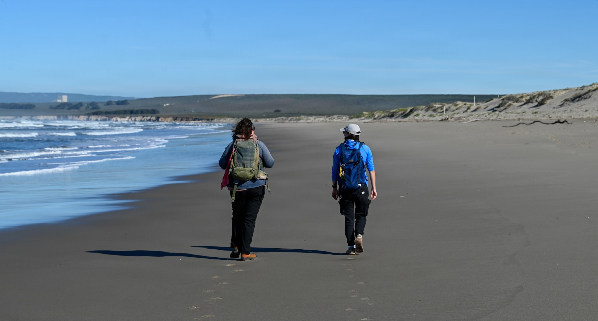 Emily Rice, left, Coastal Program Biologist with Point Blue Conservation Science, discusses data with Elena Oey, right, Coastal Program Biologist with Point Blue Conservation Science, conducted during a Western Snowy Plover winter survey.