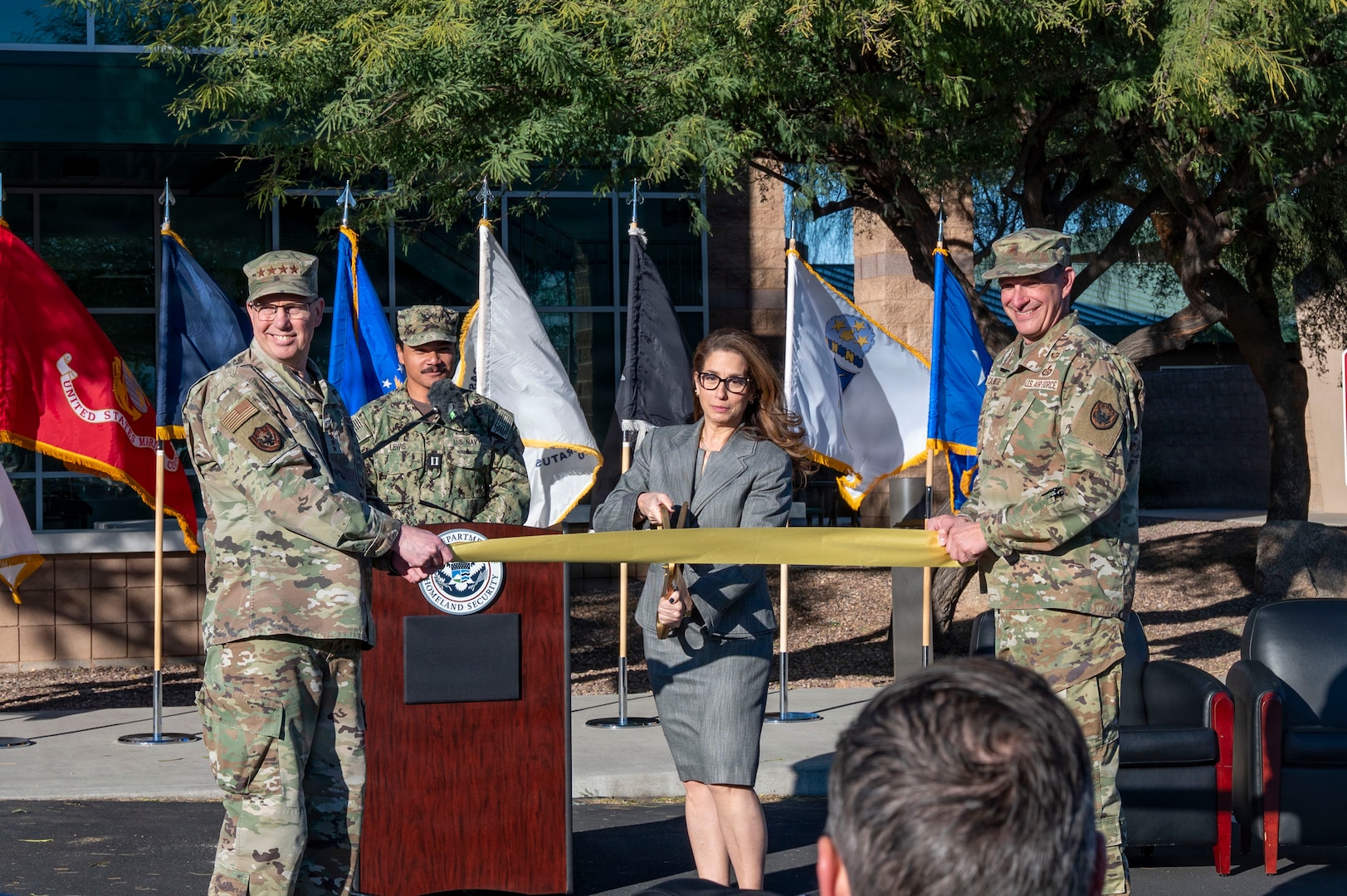 Gen. Gregory Guillot, Commander of the North American Aerospace Defense Command and U.S. Northern Command, left, and Brig. Gen. Maurizio Calabrese, director of the Joint Interagency Task Force–Counter Cartel and Commander, Joint Intelligence Task Force–Southern Border, right, stand alongside Andrea Goldbarg, special assistant to the president and senior director of the Homeland Security Council, center, during the Joint Interagency Task Force-Counter Cartel ribbon-cutting ceremony in Tucson, Arizona, Jan. 15, 2026. The event was attended by federal leaders and interagency partners representing multiple departments and agencies. (U.S. Air Force photo by Senior Airman Jhade Herrera)