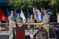 Gen. Gregory Guillot, Commander of the North American Aerospace Defense Command and U.S. Northern Command, left, and Brig. Gen. Maurizio Calabrese, director of the Joint Interagency Task Force–Counter Cartel and Commander, Joint Intelligence Task Force–Southern Border, right, stand alongside Andrea Goldbarg, special assistant to the president and senior director of the Homeland Security Council, center, during the Joint Interagency Task Force-Counter Cartel ribbon-cutting ceremony in Tucson, Arizona, Jan. 15, 2026. The event was attended by federal leaders and interagency partners representing multiple departments and agencies. (U.S. Air Force photo by Senior Airman Jhade Herrera)