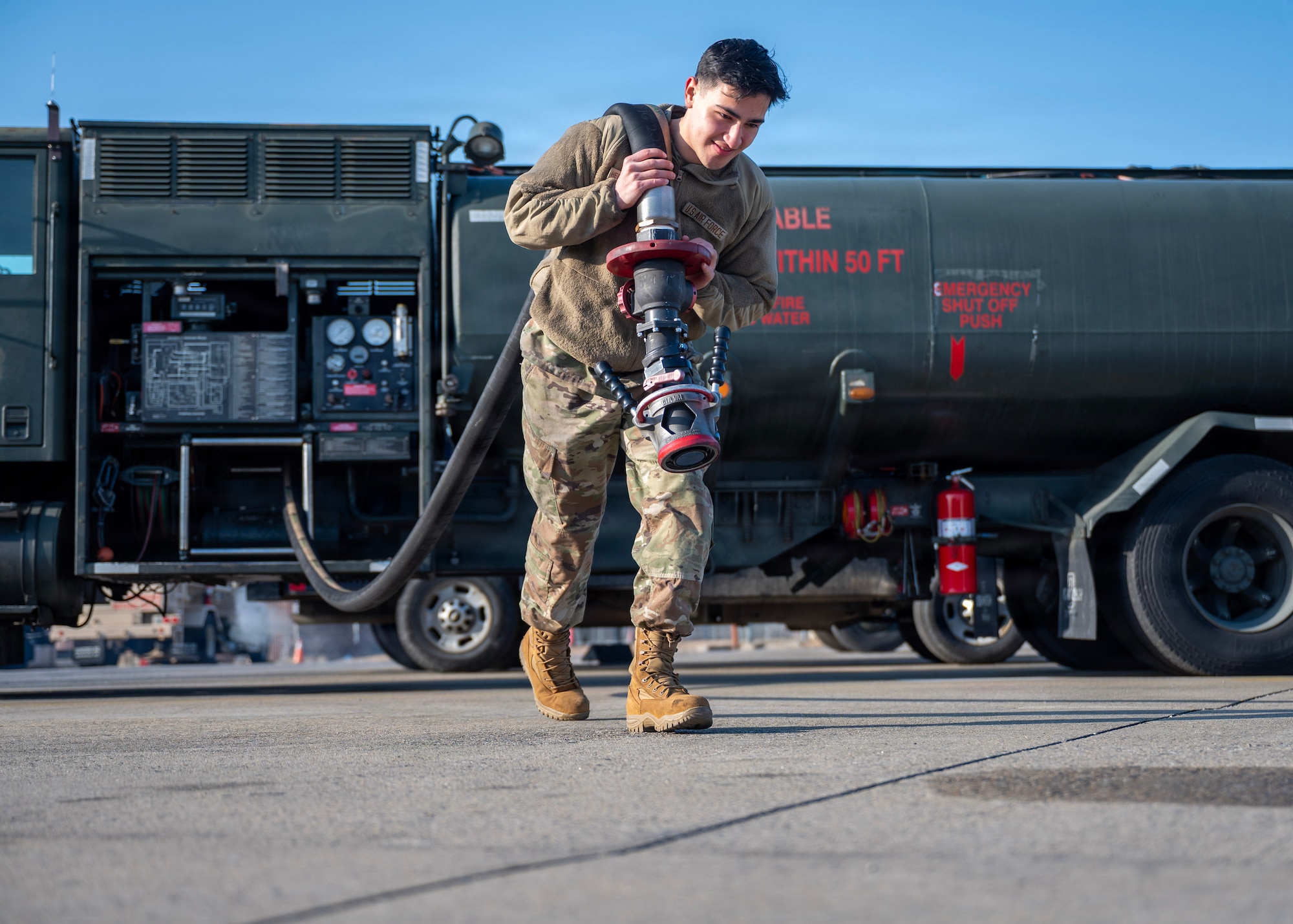 U.S. Air Force Airman 1st Class Jeffrey Hernandez-Mendez, 51st Logistics Readiness Squadron fuels maintenance technician, pulls a hose at Osan Air Base, Republic of Korea, Jan. 14, 2026. He served as the secretary of the Rising Four, supporting volunteer events and developing leadership skills, while regularly assisting new Airmen in his squadron with in-processing, flightline orientation and adjusting to life on base.  (U.S. Air Force photo by Staff Sgt. Sarah Williams)