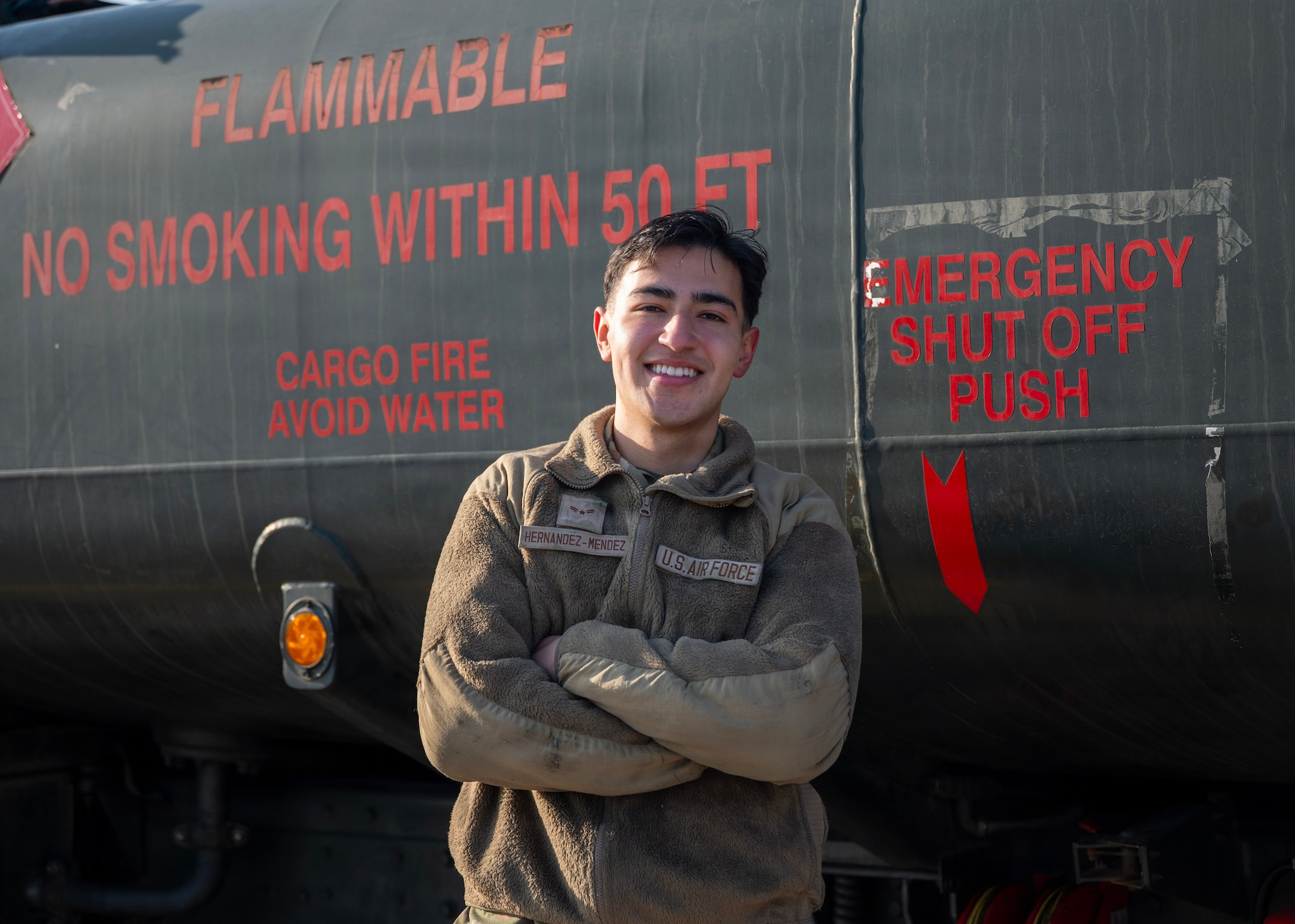 U.S. Air Force Airman 1st Class Jeffrey Hernandez-Mendez, 51st Logistics Readiness Squadron fuels maintenance technician, poses for a picture in front of a refueling truck at Osan Air Base, Republic of Korea, Jan. 14, 2026. Hernandez-Mendez’s responsibilities range from daily truck inspections and fuels recirculation to documenting discrepancies and coordinating repairs to keep fueling assets mission-ready. (U.S. Air Force photo by Staff Sgt. Sarah Williams)