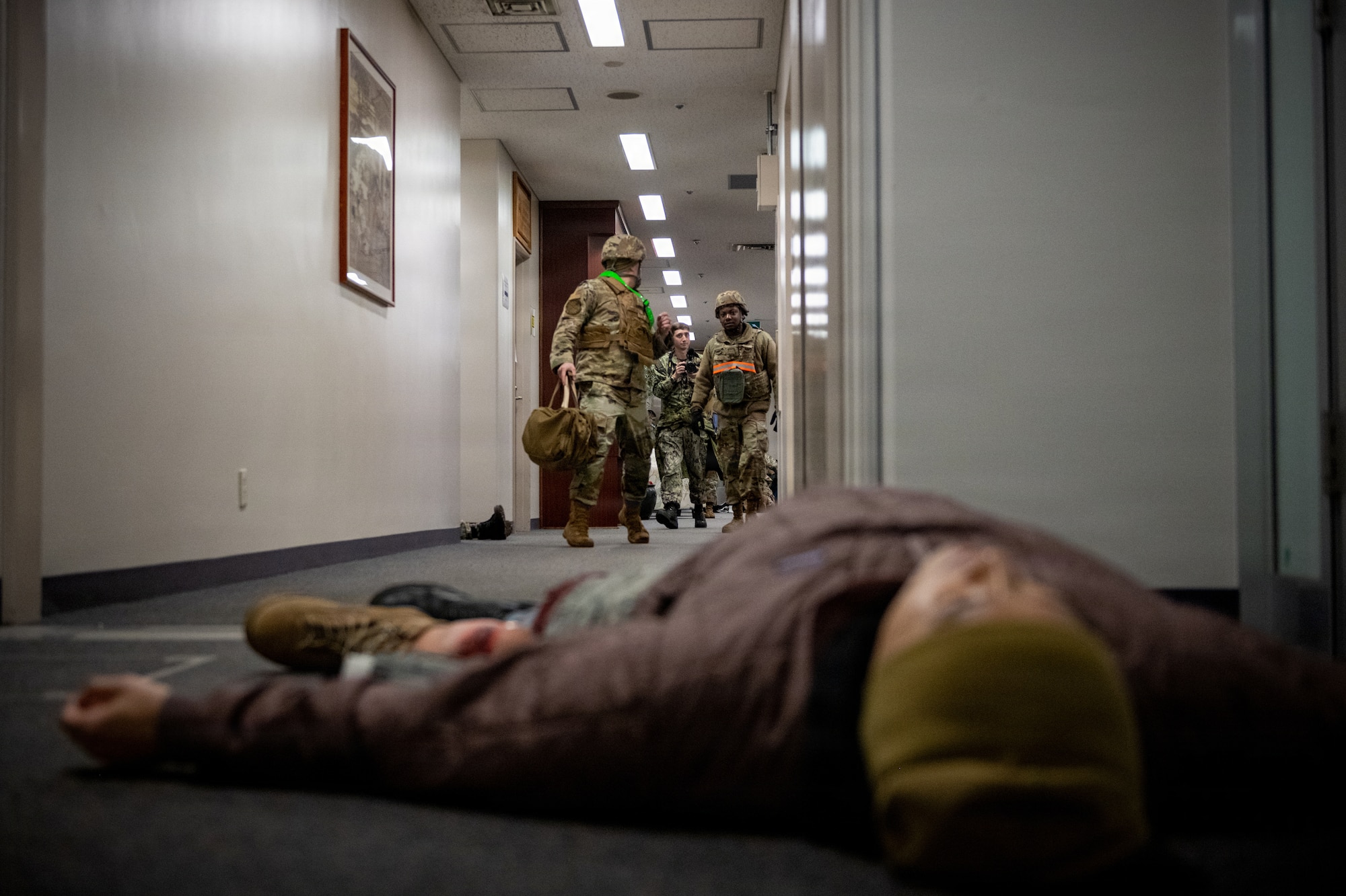 U.S. Airmen assigned to the 35th Comptroller Squadron find a simulated patient as part of a mass casualty exercise during Sprint 26-2.