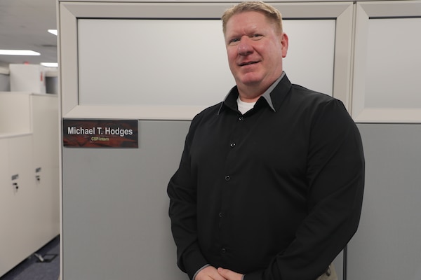 Sgt. 1st Class Michael T. Hodges, a SkillBridge intern at the U.S. Army Corps of Engineers – Far East District (USACE FED) in the Resource Management Office, poses for a photo at his workstation area while supporting FED’s financial and business operations during his internship on January 9, 2026, at Camp Humphreys, South Korea. Hodges said he chose USACE FED because the organization offers a unique opportunity to apply his background in business, logistics and leadership within a mission driven, team oriented environment. (U.S. Army photo by Yohan An)
