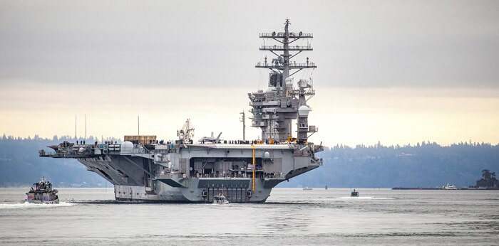 USS Nimitz (CVN 68) makes its way past Manchester State Park as it exits Rich Passage Feb. 7, 2022, after departing Puget Sound Naval Shipyard & Intermediate Maintenance Facility in Bremerton, Washington. Nimitz is currently underway conducting routine operations. (PSNS & IMF photo by Scott Hansen)