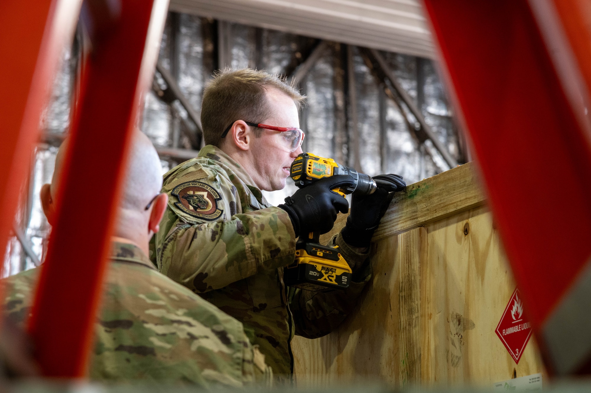 U.S. Air Force Senior Airman Eric Austin,13th Fighter Generation Squadron F-35 crew chief, initiates the unloading process for F-35A Lightning II support equipment at Misawa Air Base, Japan, Jan. 13, 2026.