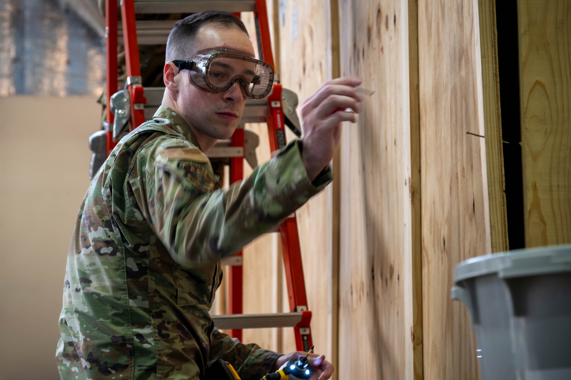 U.S. Air Force Staff Sgt. Preston Quittner, 13th Fighter Generation Squadron weapons load crew member, discards a nail during F-35A Lightning II support equipment preparation at Misawa Air Base, Japan, Jan. 13, 2026.