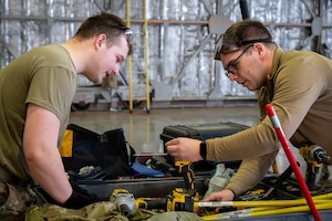 U.S. Air Force Senior Airmen Joseph Lawton and Matthew Anderson,13th Fighter Generation Squadron support crew chiefs, verify tools while unpacking cargo crates containing F-35A Lightning II fighter aircraft support equipment at Misawa Air Base, Japan, Jan. 13, 2026.