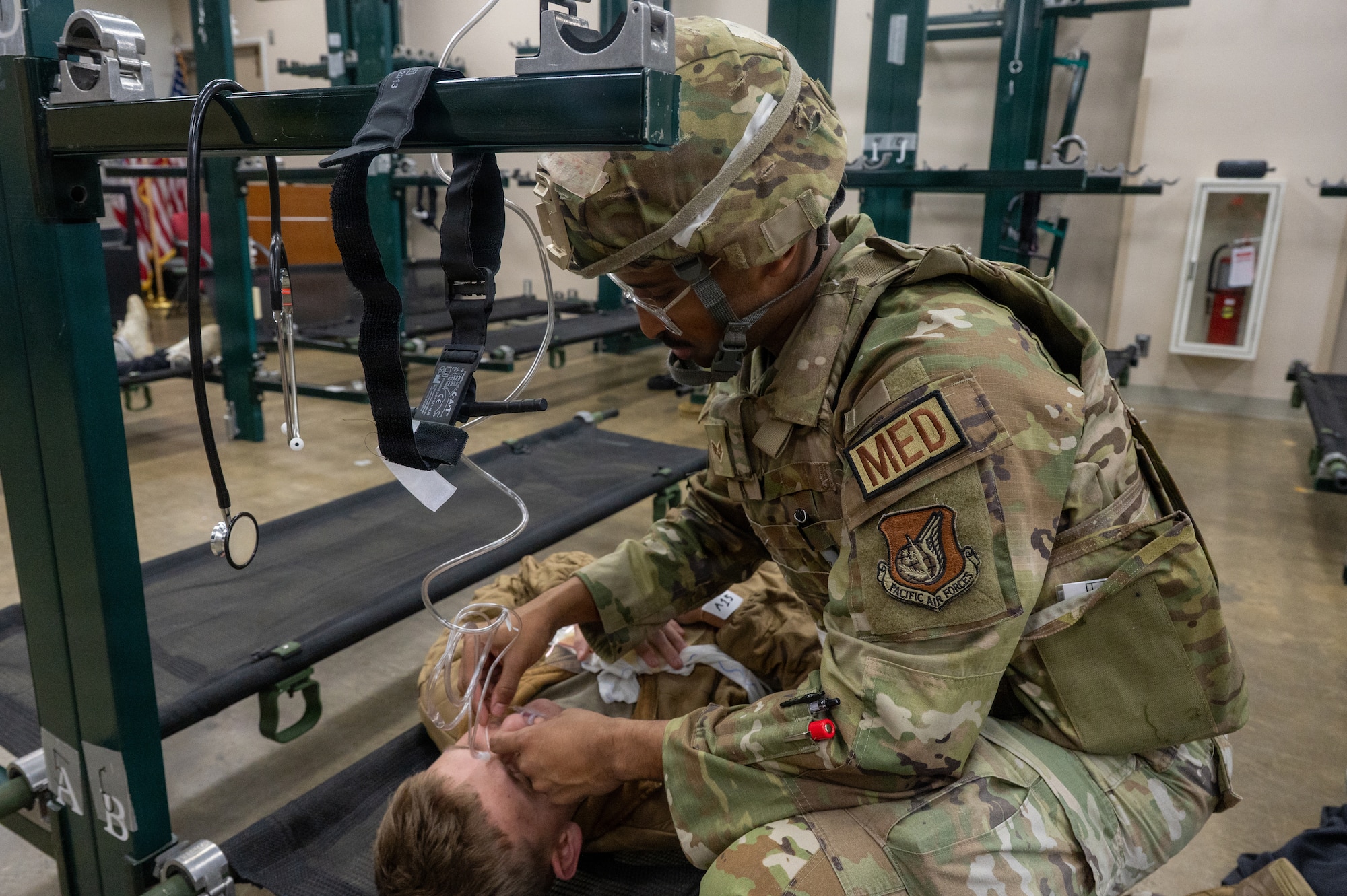 U.S. Air Force Senior Airman Fuad Ali, 35th Medical Group warrior medicine technician, simulates a medical check up during exercise Sprint 26-2.