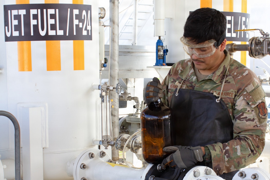 Airmen inspecting fuel