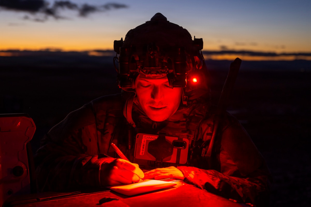 Staff Sgt. Joshua Lapooh, a tactical air control party specialist with the 124th Air Support Operations Squadron, documents targeting information during a night training exercise at Saylor Creek Range, Idaho, Jan. 9, 2026. The specialists directed A-10 Thunderbolt II pilots from the 190th Fighter Squadron through training gun runs to improve their proficiency in supporting ground forces in low-light conditions. (U.S. Air National Guard photo by Master Sgt. Mercedee Wilds)