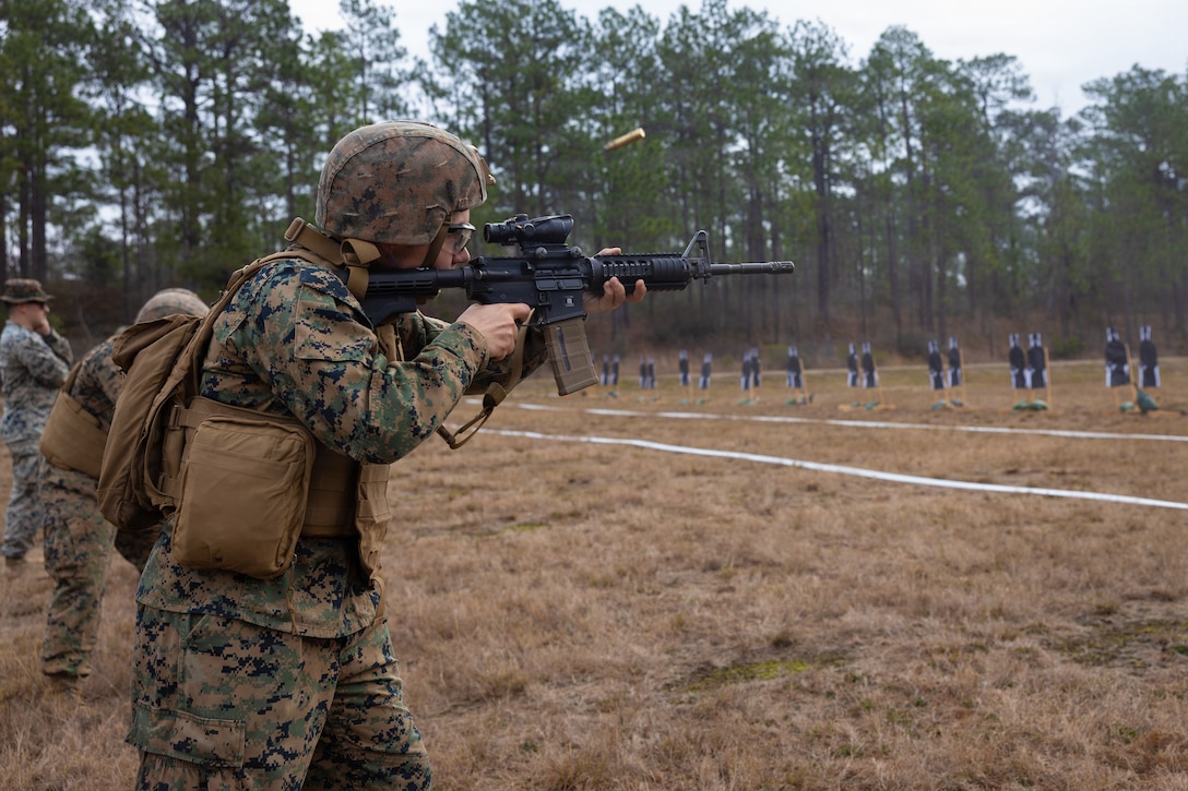 U.S. Marine Corps Lance Cpl. Megan E. Stevens, a motor transportation operator with Truck Company, 23rd Marine Regiment, 4th Marine Division, fires an M4 carbine during annual training at Fort Polk, Louisiana, Jan. 9, 2026. Marines conducted a known distance range to enhance marksmanship fundamentals and combat readiness. (U.S. Marine Corps photo by Lance Cpl. Claire Cheney)
