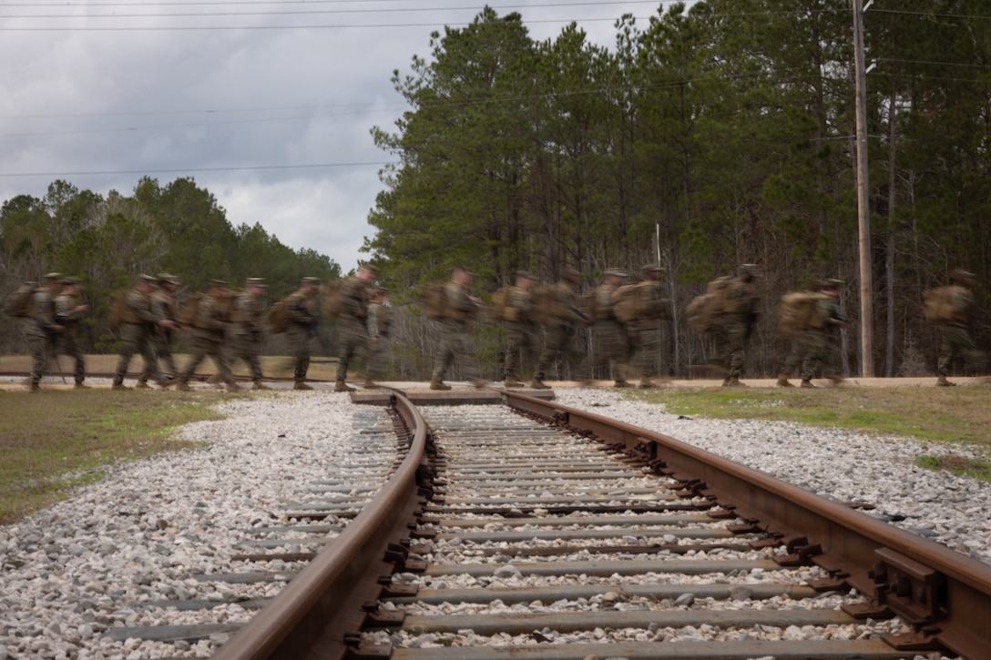 U.S. Marines with Truck Company, 23rd Marine Regiment, 4th Marine Division, hike at Fort Polk, Louisiana, Jan. 9, 2026. Marines with Truck company departed a known distance range, which enhanced marksmanship fundamentals and combat readiness. (U.S. Marine Corps photo by Lance Cpl. Claire Cheney)