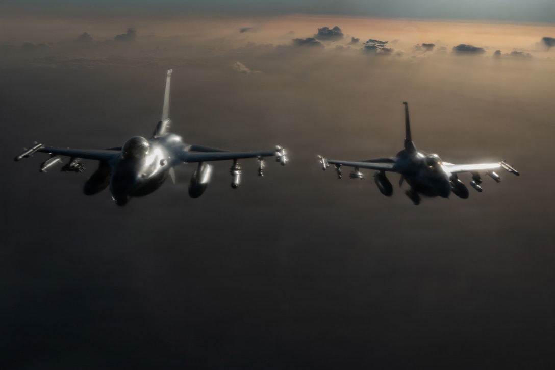 U.S. Air Force F-16 Fighting Falcon aircraft fly during a mission in the U.S. Central Command area of responsibility, Jan. 7, 2026. The Fighting Falcon demonstrates U.S. commitment to regional security by providing responsive airpower and deterring potential threats within the USCENTCOM AOR. (U.S. Air Force photo by Airman 1st Class Travis Knauss)