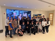 Dr. Shane Wines (far left) alongside staff and students from Calvert High School, his former school where he taught for 10 years, on a field trip to Naval Surface Warfare Center, Carderock Division in West Bethesda, Md., in December 2025.